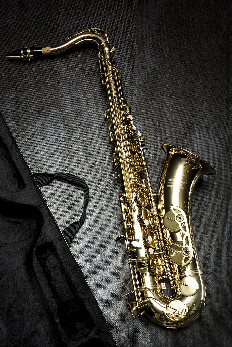 gold saxophone, saxophone, music, still life, musical instrument, arts culture and entertainment, metal, indoors, wind instrument, wall - building feature
