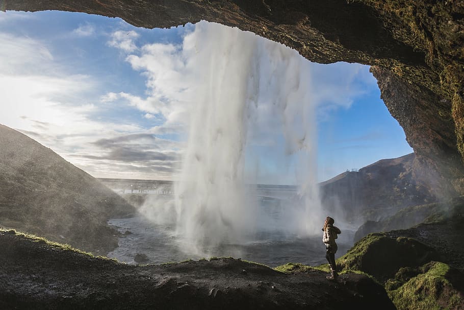 woman, taking, inside, skogafoss, falls, waterfalls, rocks, cave, nature, hill
