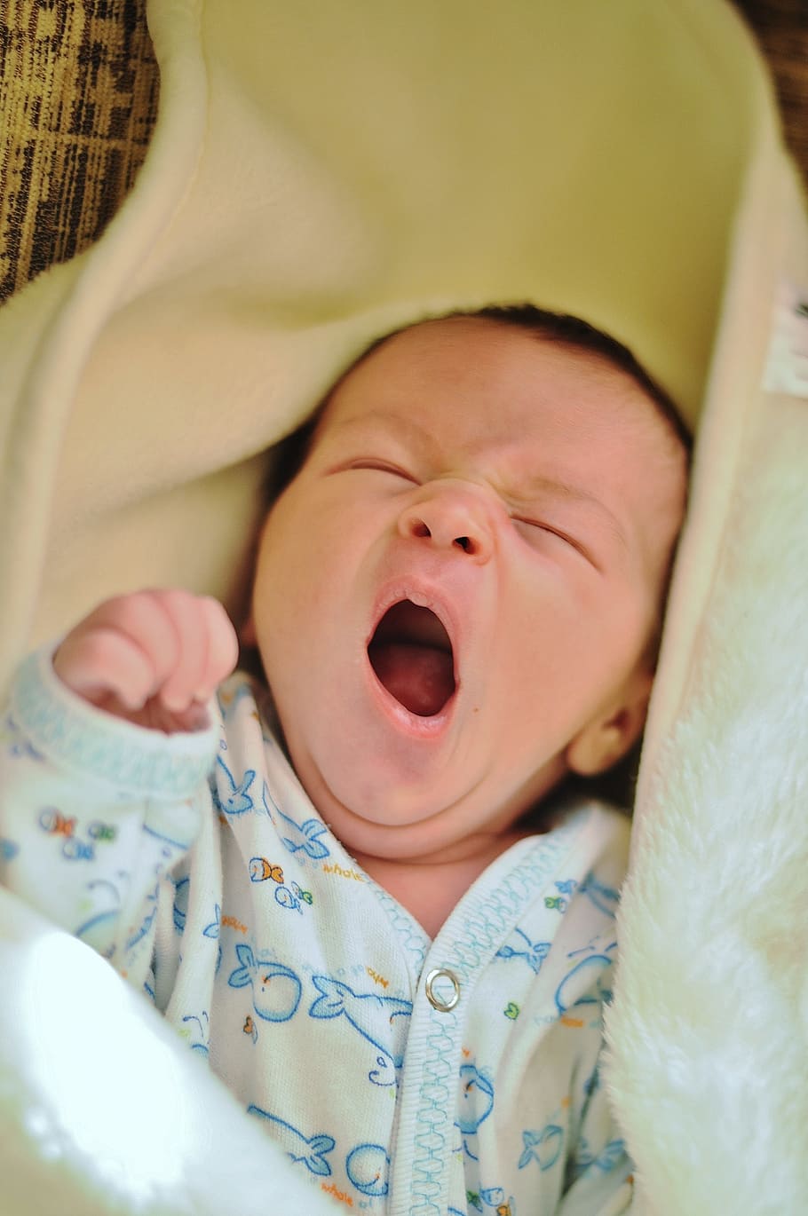 baby, wearing, onesie, yawning, blanket, white, shirt, yellow, textile, newborn