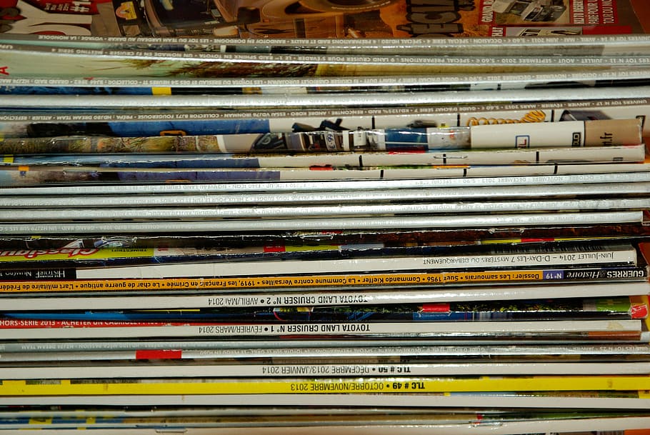 pile of magazines, magazines, journals, newspaper reading, large group of objects, indoors, abundance, full frame, stack, publication