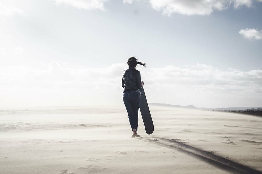 woman, walking, barefoot, desert, holding, sled, daytime, people, girl, sunny