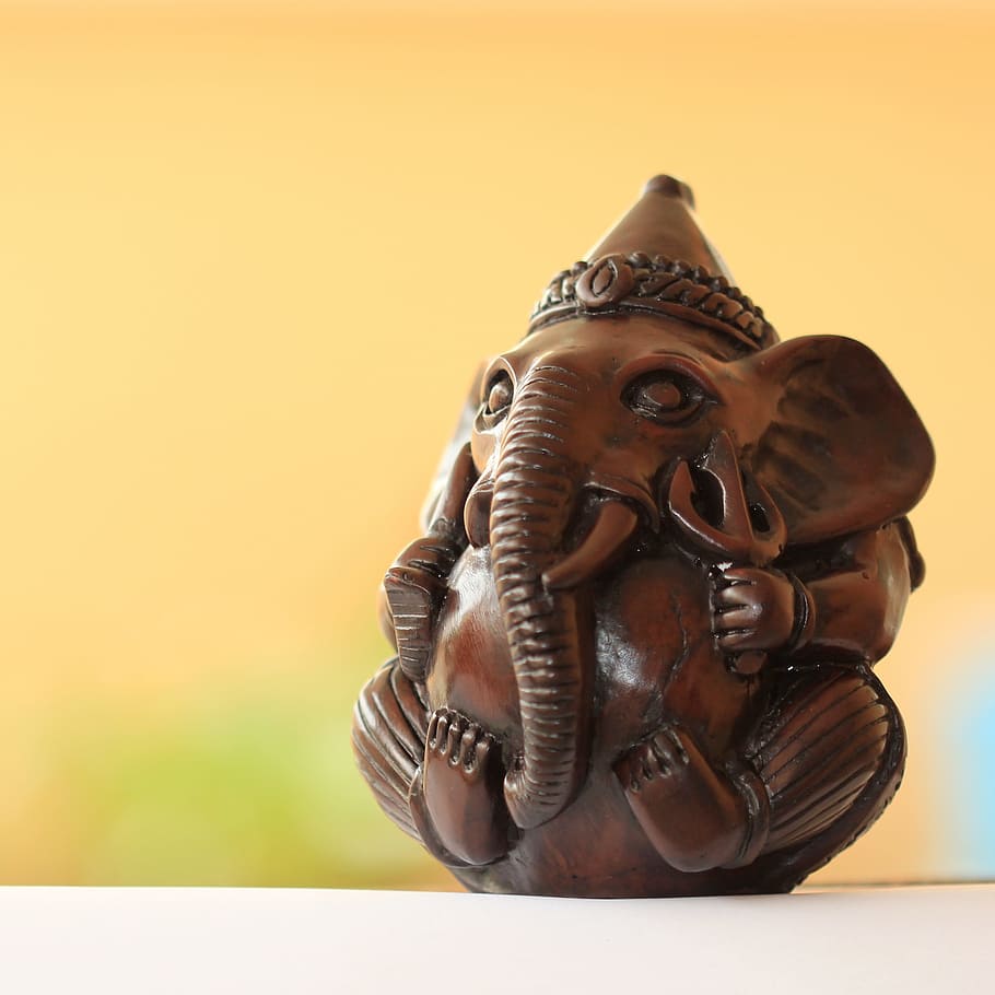 brown, wooden, elephant figurine, white, surface, ganesh, ganesha, yellow, god, hindu