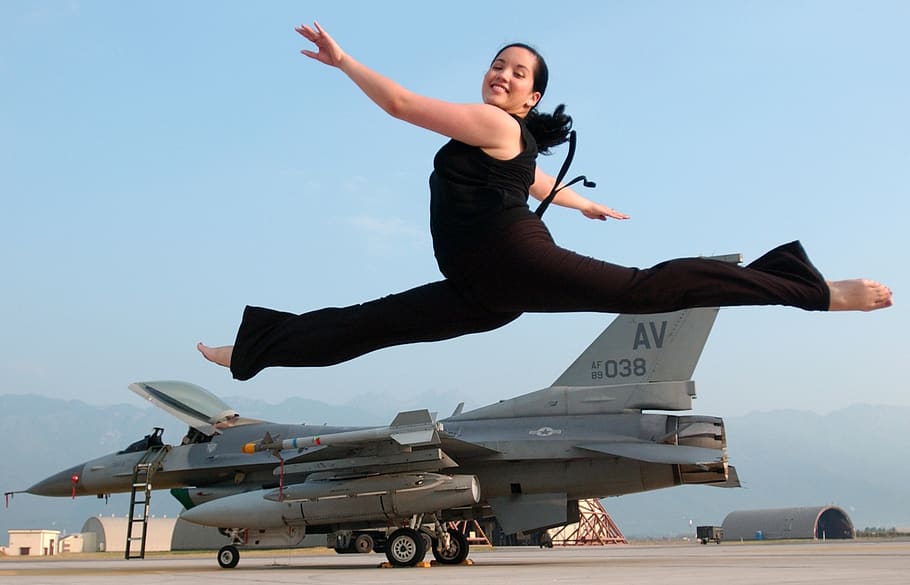 ballet leap, jeté, jump, female, happy, smile, aircraft, jet, military, runway