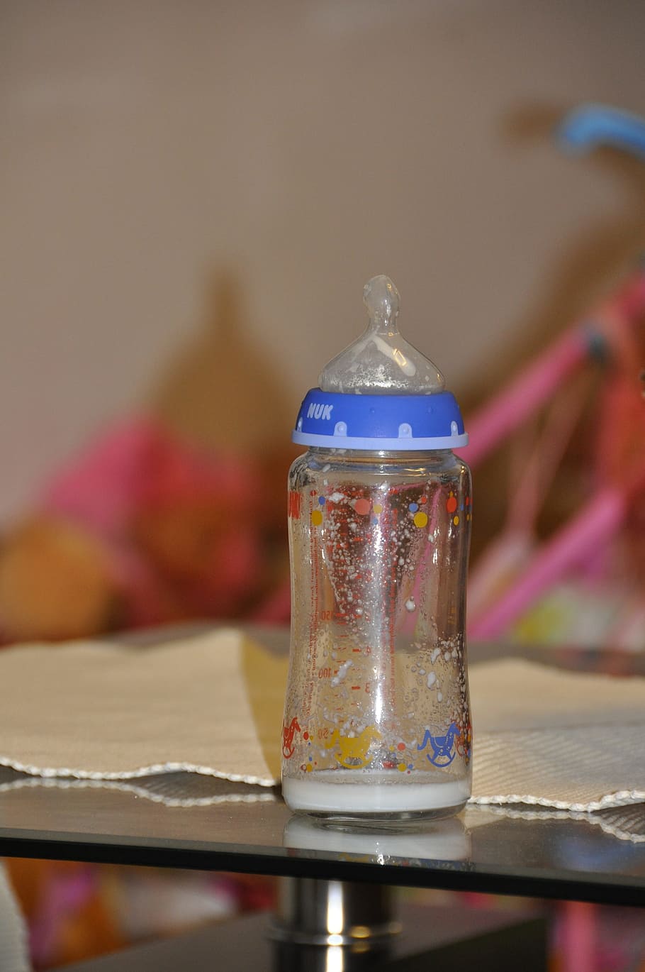 empty vials, baby, bottle, table, focus on foreground, indoors, close-up, container, glass - material, transparent