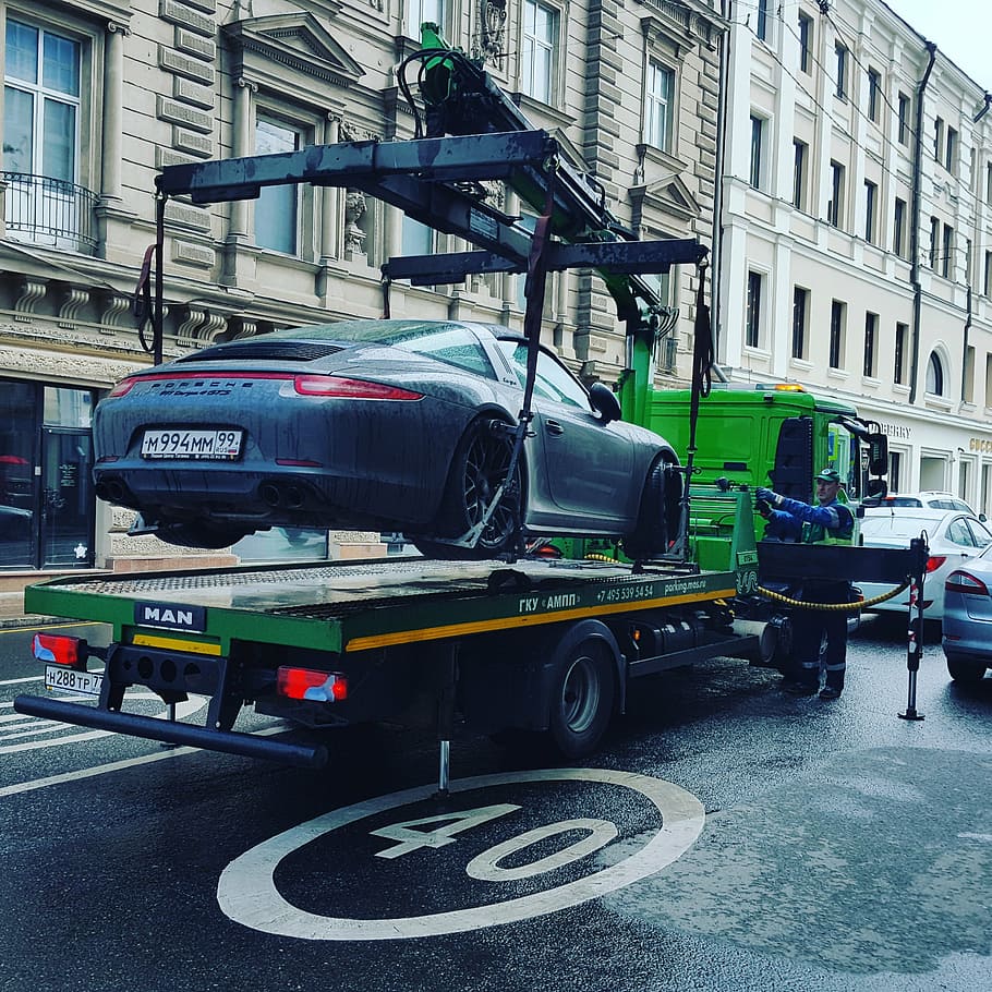 green, tow truck, lifting, gray, porsche sports coupe, concrete, road, daytime, evacuate, tow away