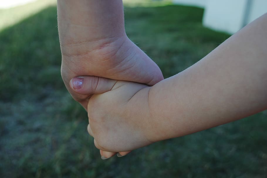 selective, focus photo, two, person, holding, hand, selective focus, hands, children, siblings