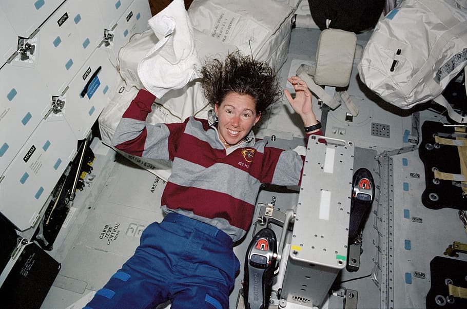 female astronaut washing hair, space, shuttle, atlantis, space shuttle, spacecraft, vehicle, mission, exploration, flight