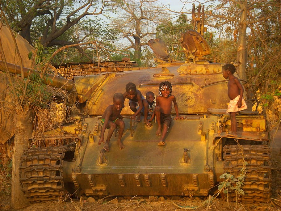 children, war, tank, africa, group of people, tree, plant, men, architecture, nature