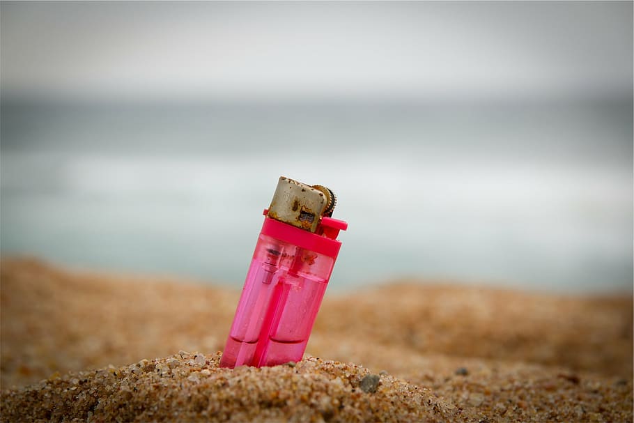pink, disposable, lighter, buried, sand, brown, day, beach, focus on foreground, outdoors