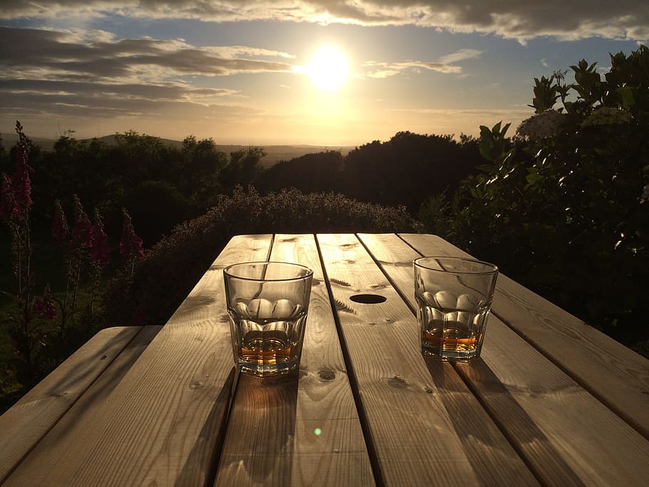 two, clear, drinking glasses, brown, wooden, table, sunset, sunrise, glass, whiskey