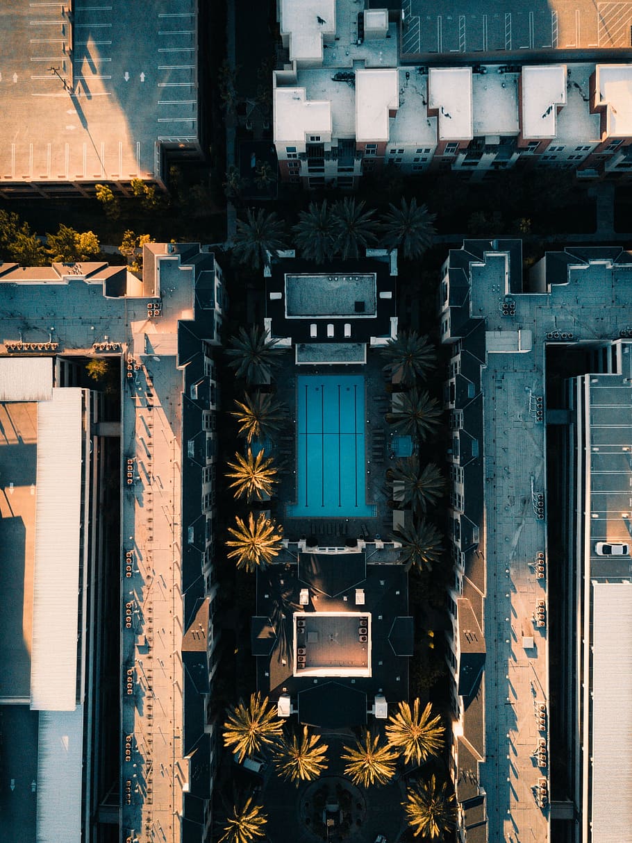 aerial, shot, swimming, pool, surrounded, high-rise, buildings, daytime, architecture, building