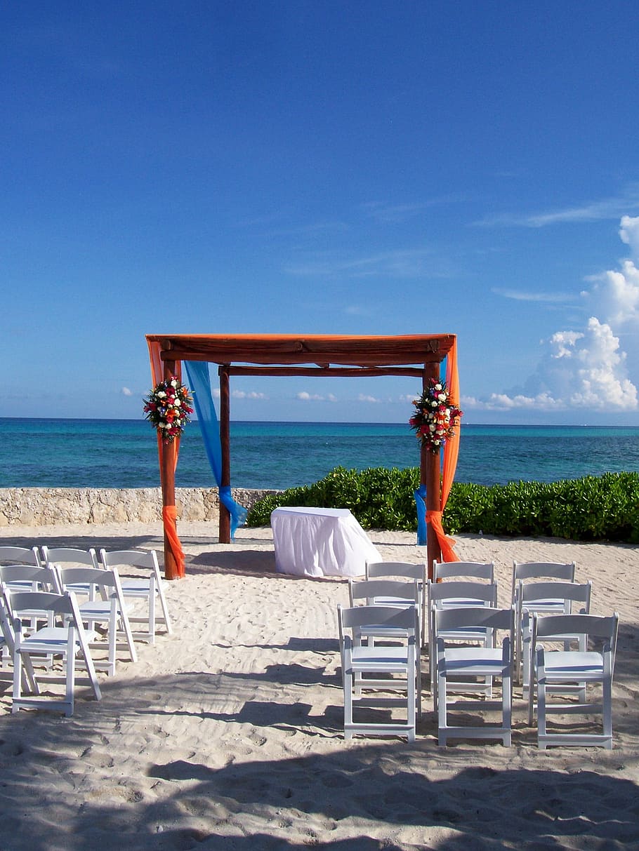 white, wooden, folding, chairs, front, red, gazebo, mexico, beach, sand