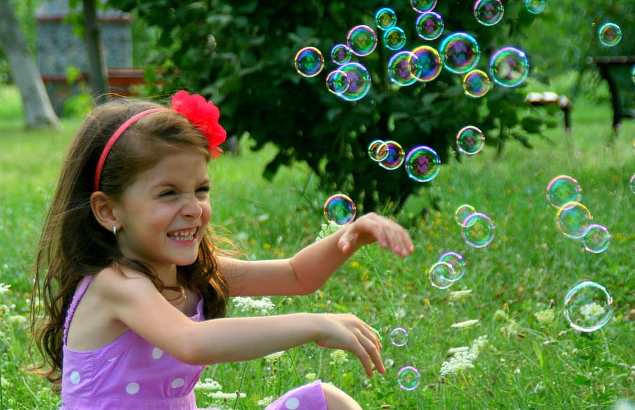 girl, wearing, pink, dress, sitting, grass, bubbles, soap bubbles, smile, bubble