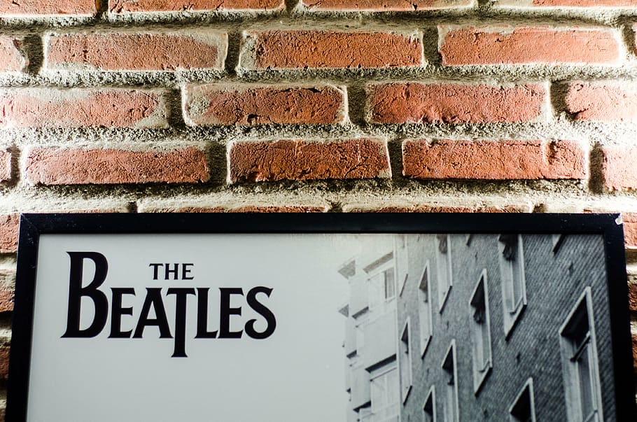 the beatles poster, bricks, wall, frame, band, light, old, indoor, brick wall, text