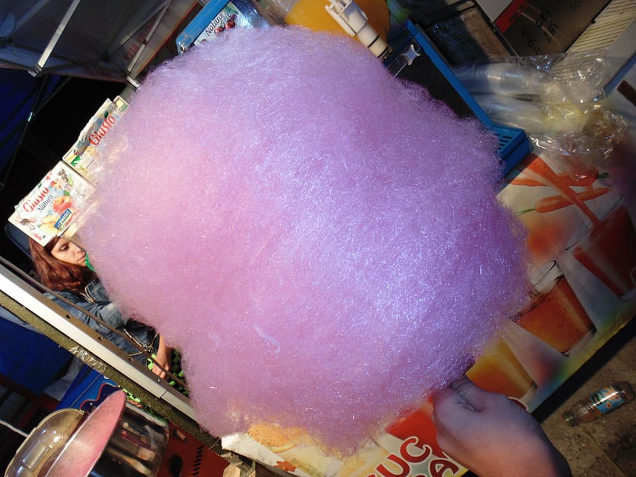 pink cotton candy, cotton candy, pink, hand, real people, high angle view, lifestyles, indoors, incidental people, food