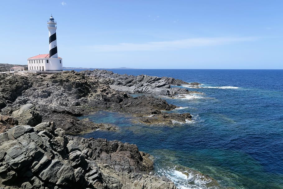 white, black, lighthouse, cliff, body, water, daytime, side, minorca, cape favaritx