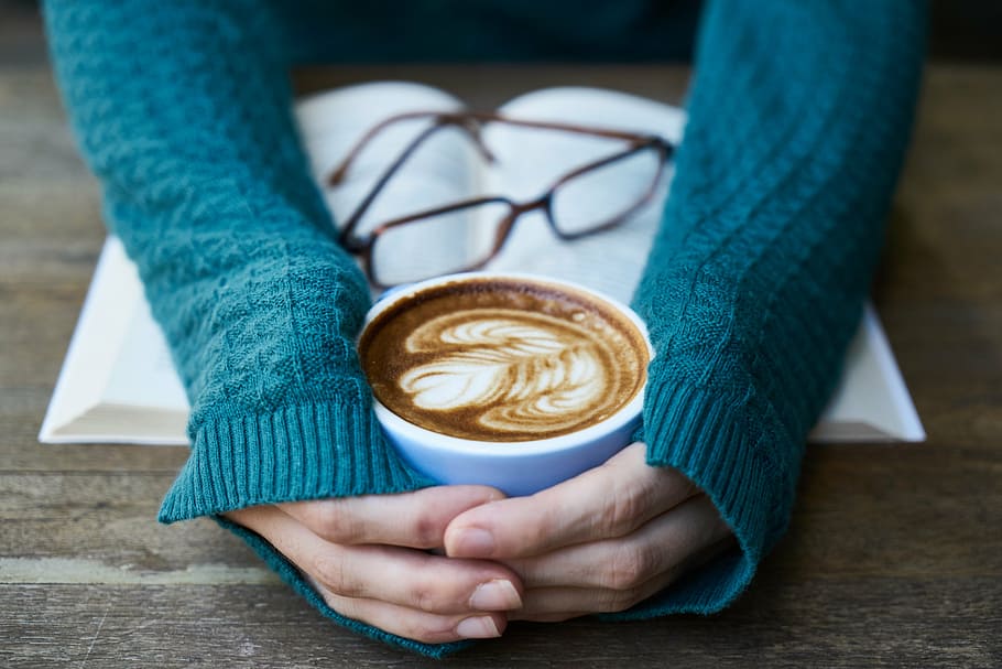 person, hand, holding, white, ceramic, coffee mug, filled, latte, coffee, caffeine