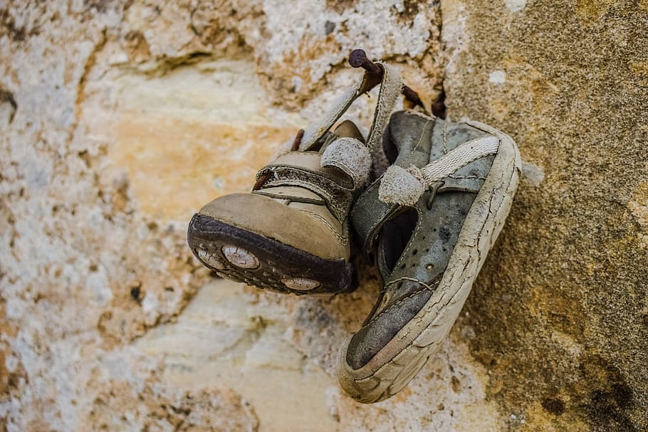 old shoes, child shoes, hanging, offer to saint, church wall, religious faith, tersefanou, cyprus, decay, shoe