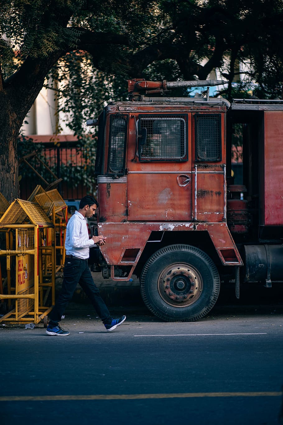 person, walking, red, truck, alone, asian, bangladesh, book, candid, casual