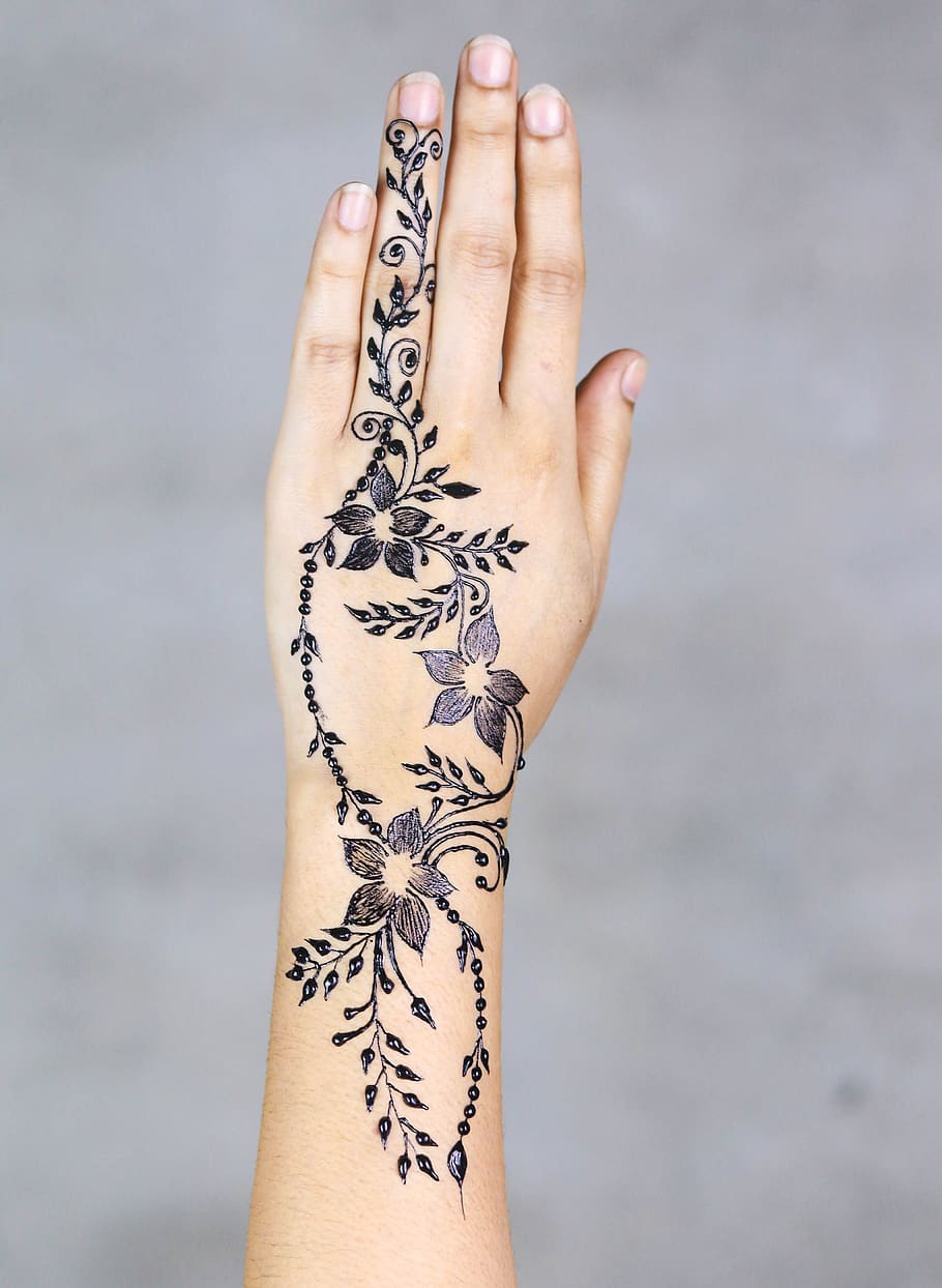 Henna tattoo on female hand isolated on white background Stock Photo   Adobe Stock
