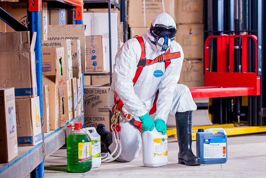 man, wearing, coveralls, holding, white, bottle, chemist, costume, protection, security