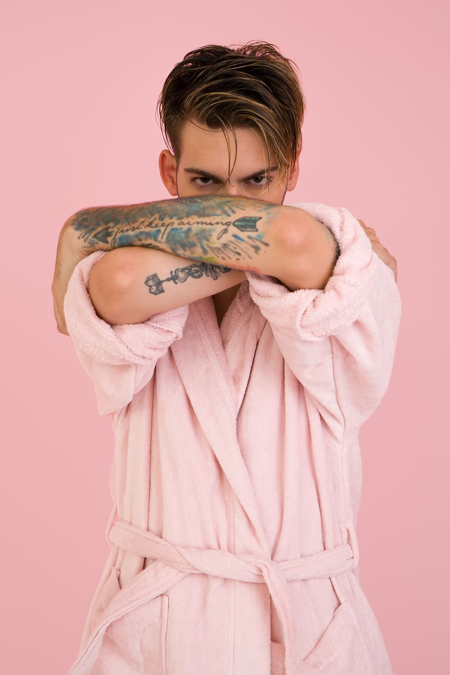 man, model, pink bathrobe, tattoo, pink background, fashion, studio shot, one person, indoors, colored background