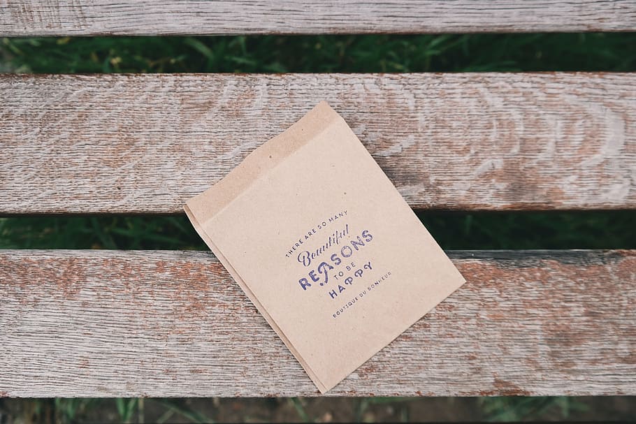 brown, paper, wood plank, reasons, happy, bag, bench, park, text, western script