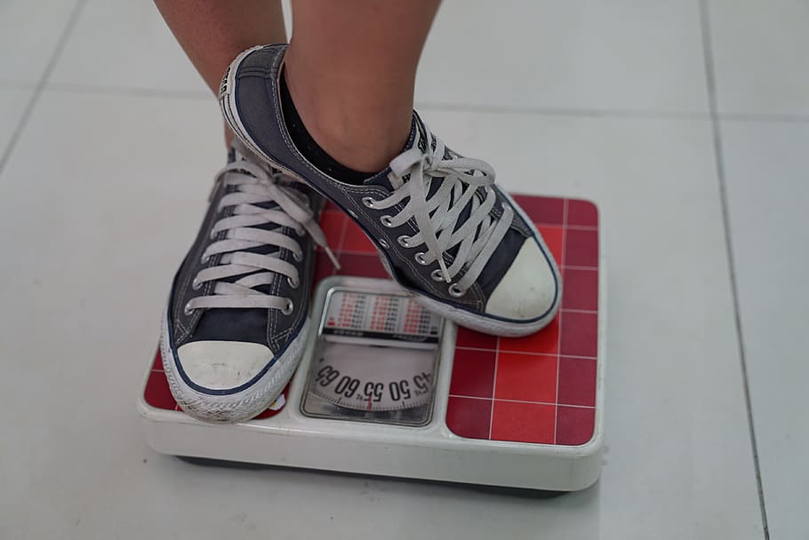weighing machine, sneakers, weight, weight management, low section, shoe, human body part, human leg, one person, body part