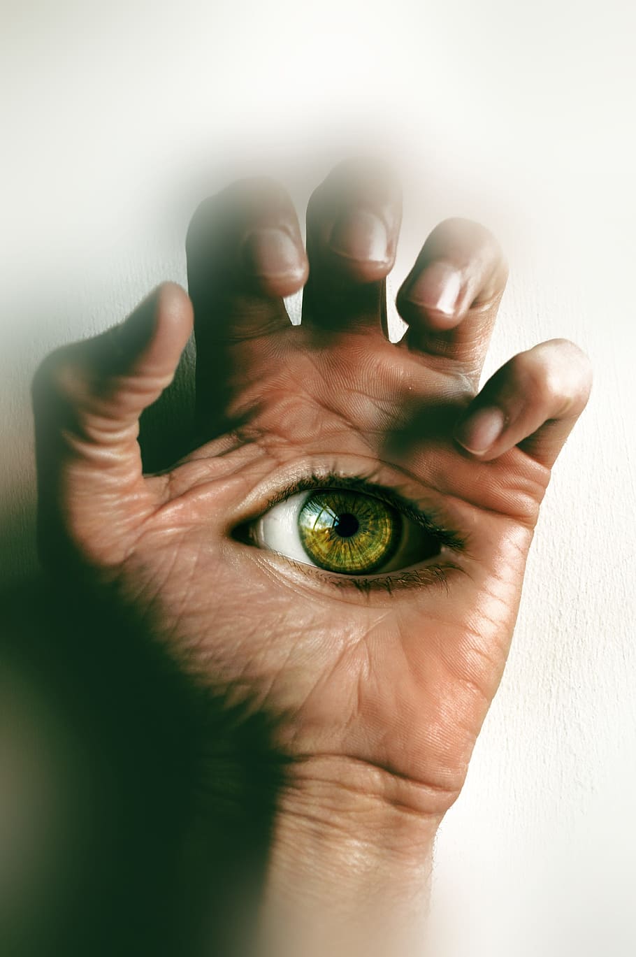 surrealism, hand, eye, fingers, eye open, one person, human body part, body part, human hand, indoors