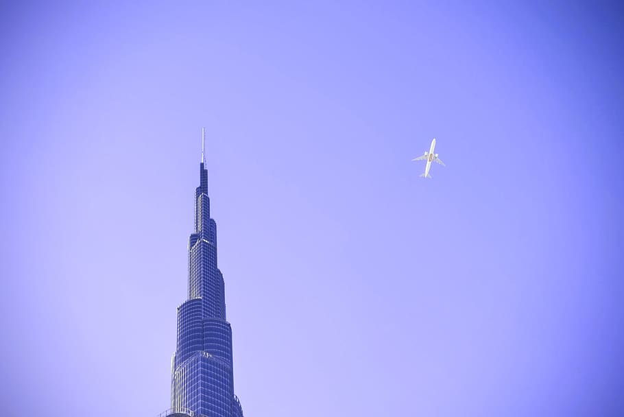 purple, sky, airplane, flying, transportation, building, architecture, tower, skyscraper, air vehicle