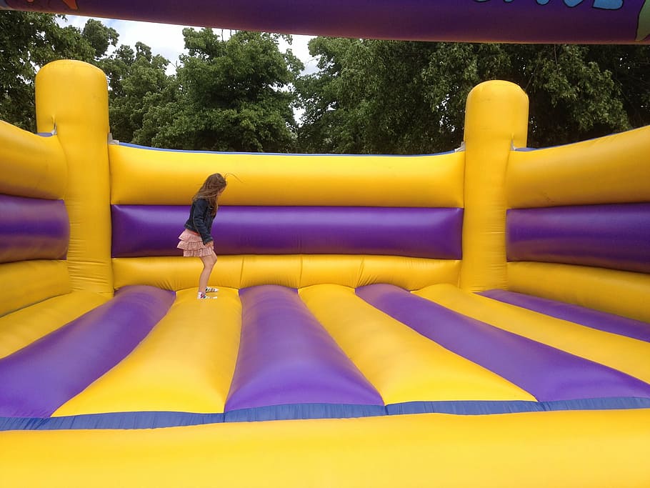 girl, jumping, yellow, purple, inflatable bouncer, bouncing castle, bouncy bounce, bouncy castle, inflatable jumper, inflatable
