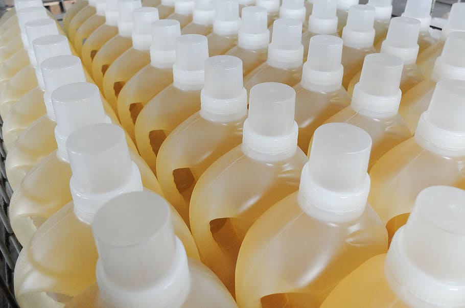 assorted-color bottle lot, bottles, jugs, liquid detergent, chemistry, commodity, contract manufacturing, plastic, large group of objects, white color
