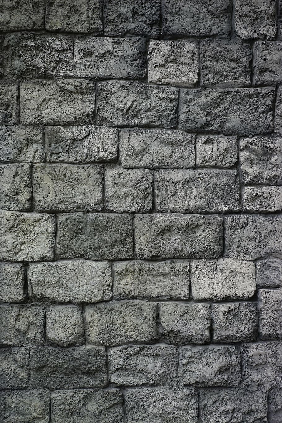 Muro de pedra natural fundo de pedra cinza um muro de pedras de vários  tamanhos cheios de cimento