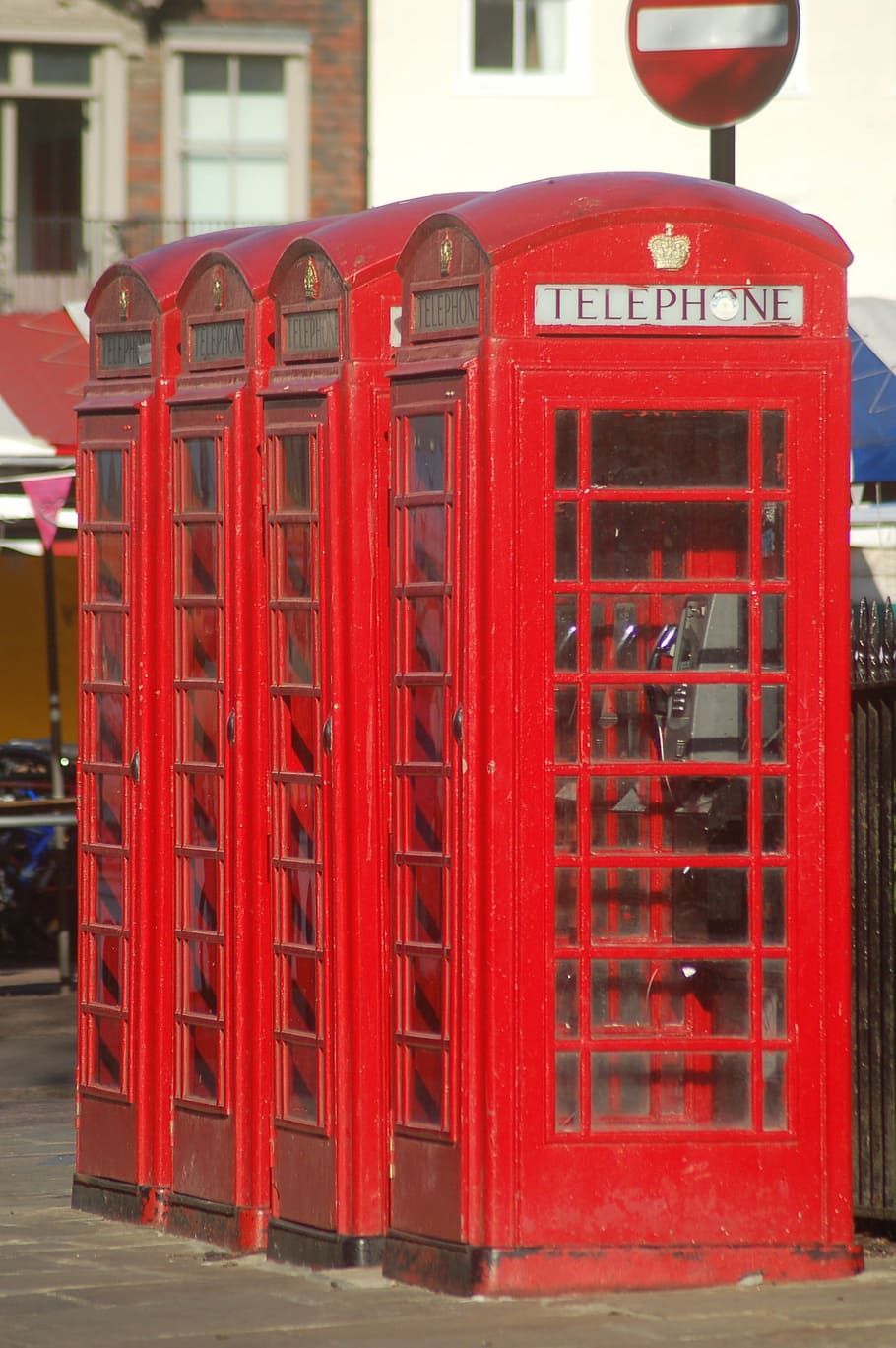public phone, red, great britain, telephone booth, telephone, communication, text, day, built structure, building exterior