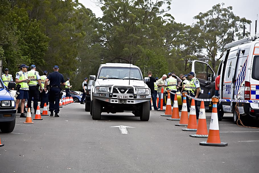 white, nissan truck, road, surrounding, policemen, police, search, road block, crime, detective