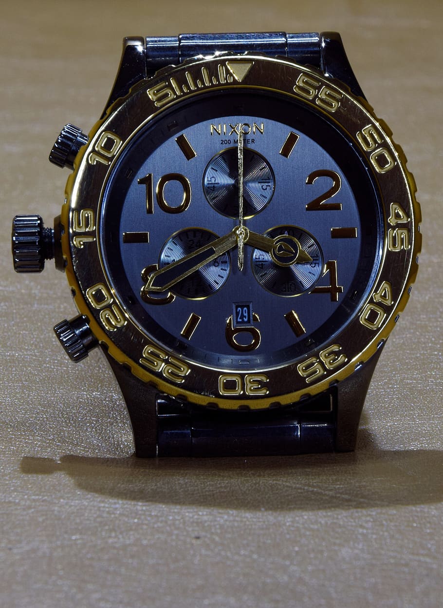 nixon, wrist watch, clock face, gold, mens, timepiece, stopwatch, close up, clock, time indicating