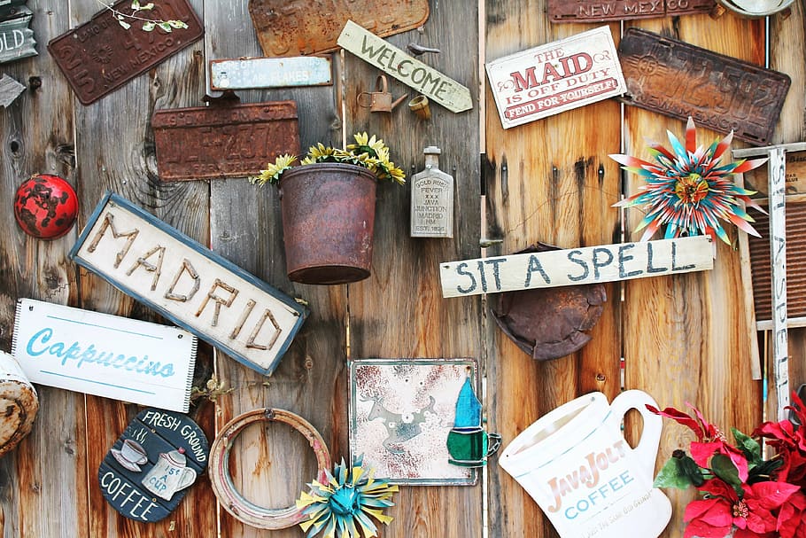 letter posters, table, coffee shop, madrid new mexico, old mining town, yard art, antique, eclectic, wooden fence, outdoor art