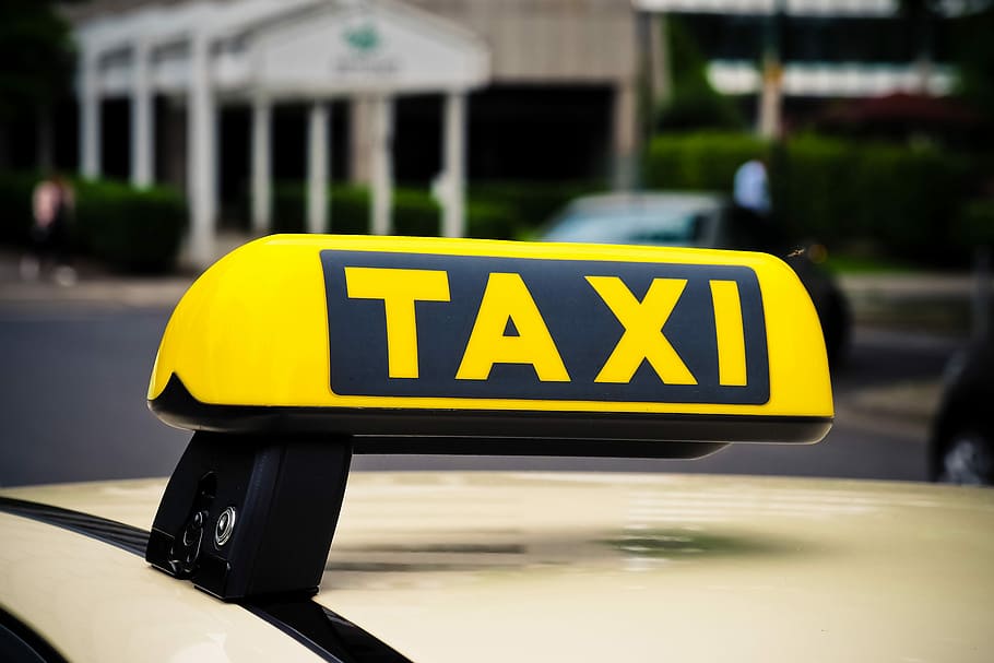 yellow, black, taxi signage, taxi, shield, auto, means of rail transport, note, transport, road
