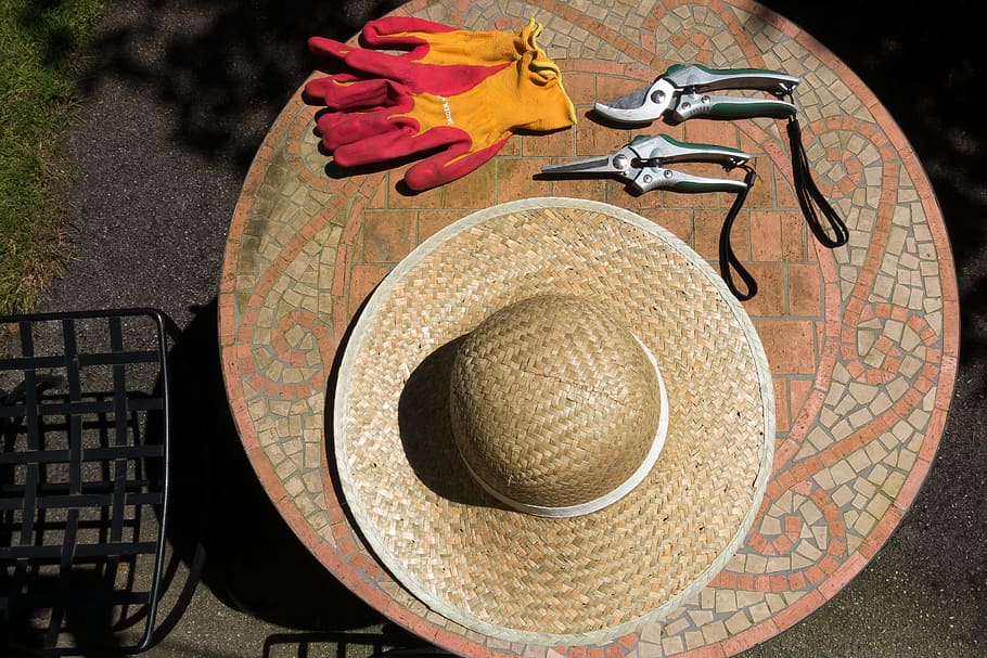 brown, wicker hat, two, cutting, tools, pink, yellow, gloves, gray, marble table