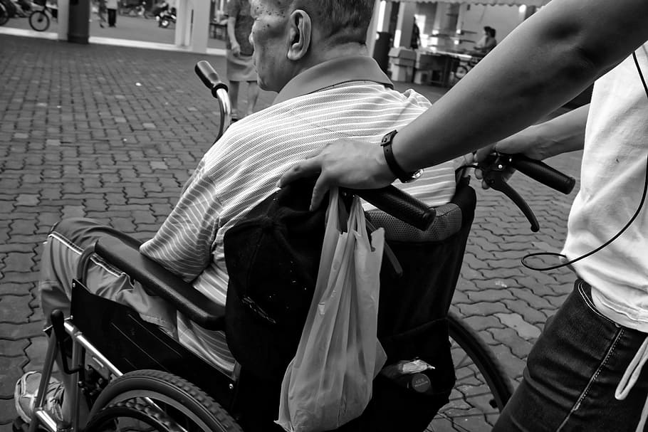 grayscale photo, man, sitting, wheelchair, elderly, pushed, carer, black and white photo, men, real people