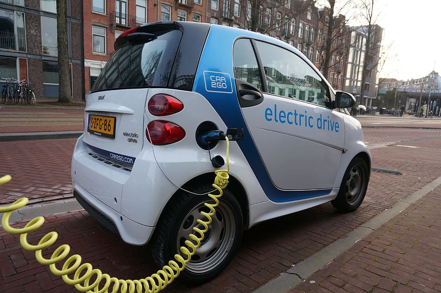 white, compact, car, parked, brown, building, daytime, amsterdam, smartcar, electric car