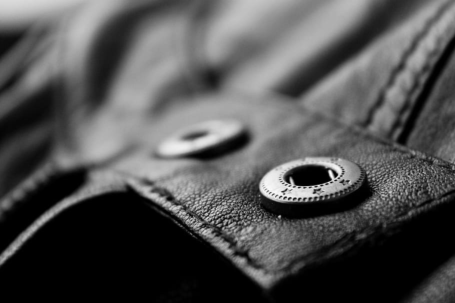 black leather jacket, leather, jacket, garment, button, textile, close-up, selective focus, indoors, clothing