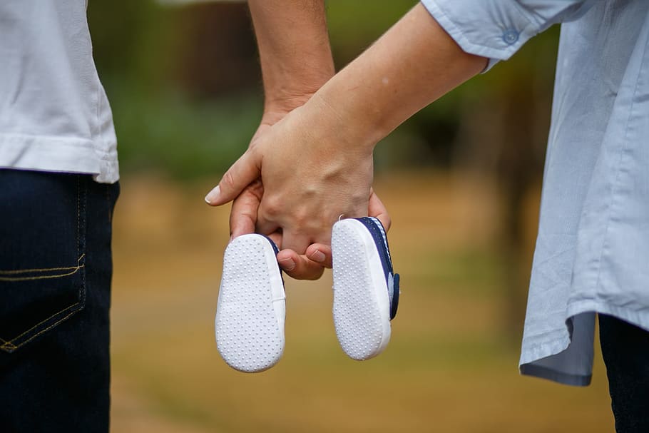 man, woman, holding, hands, pair, blue, shoes, son, pregnant woman, shoe