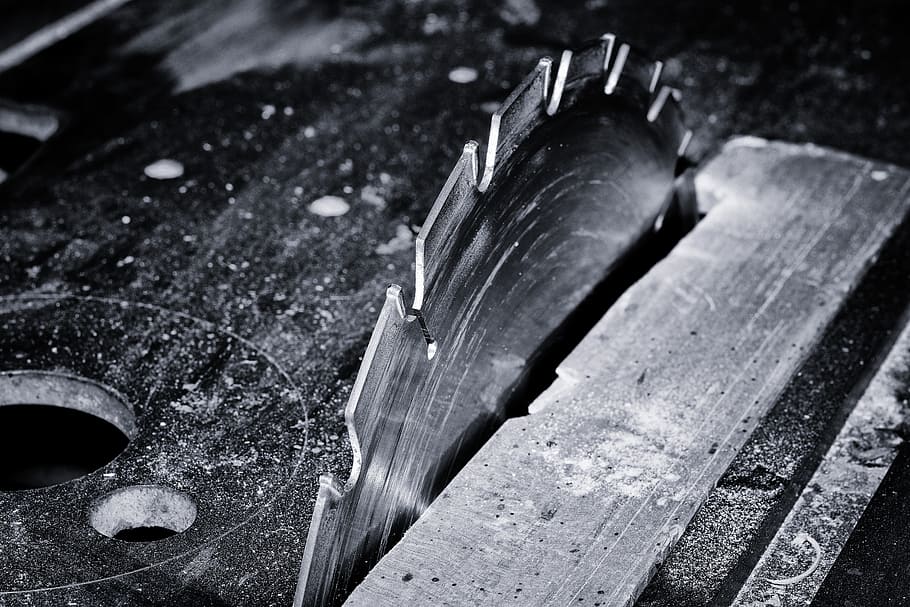 grayscale photography, table, saw, saw blade, cutting, blade, wood work, risk of injury, close, black and white recording