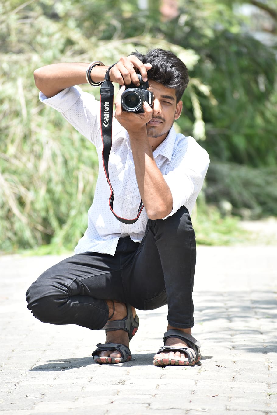 Image of A Indian Guy,Boy With Nikon Camera D750 Doing Photo Shoot And  Posing Inside Of Garden And Lake At Morning.-CN556489-Picxy