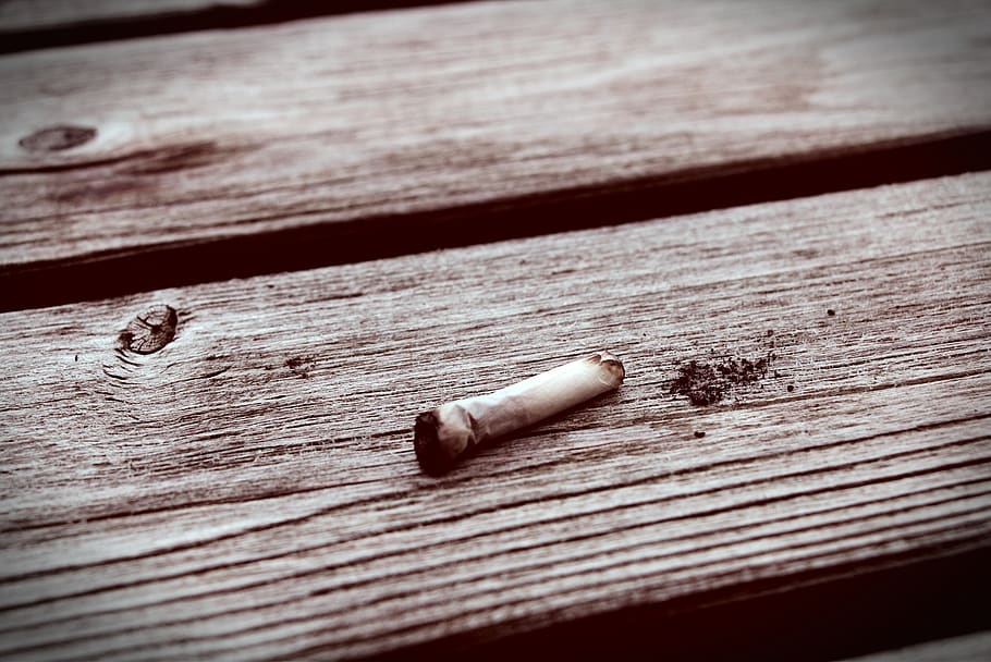dead joint, table, smoked, cancer, wood - material, social issues, cigarette, smoking issues, close-up, bad habit