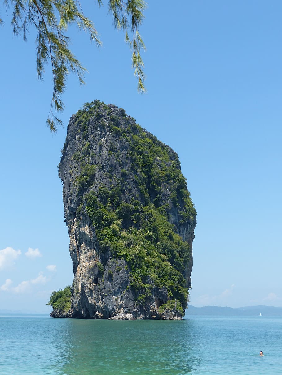 gray, rocky, monolith, covered, green, trees, plants, poda island, krabi, thailand