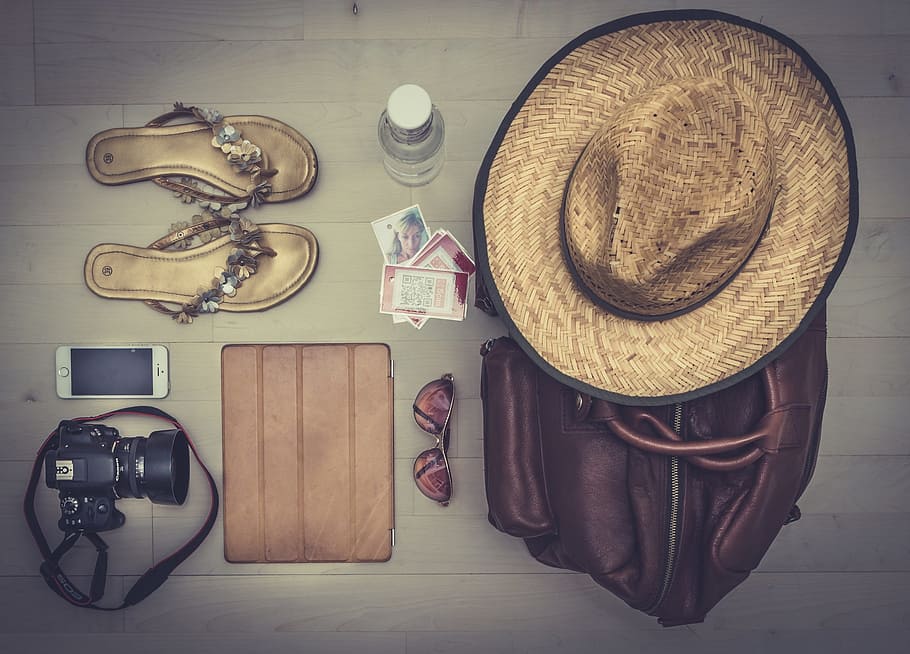 photography, brown, hat, leather bag, besides, sunglasses, leather sandals, dslr camera, silver iphone 5, 5s