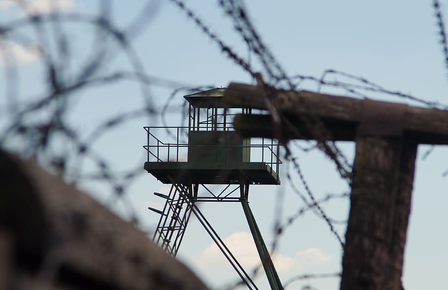 wire, sky, iron curtain, barbed wire, guard tower, architecture, low angle view, built structure, day, nature