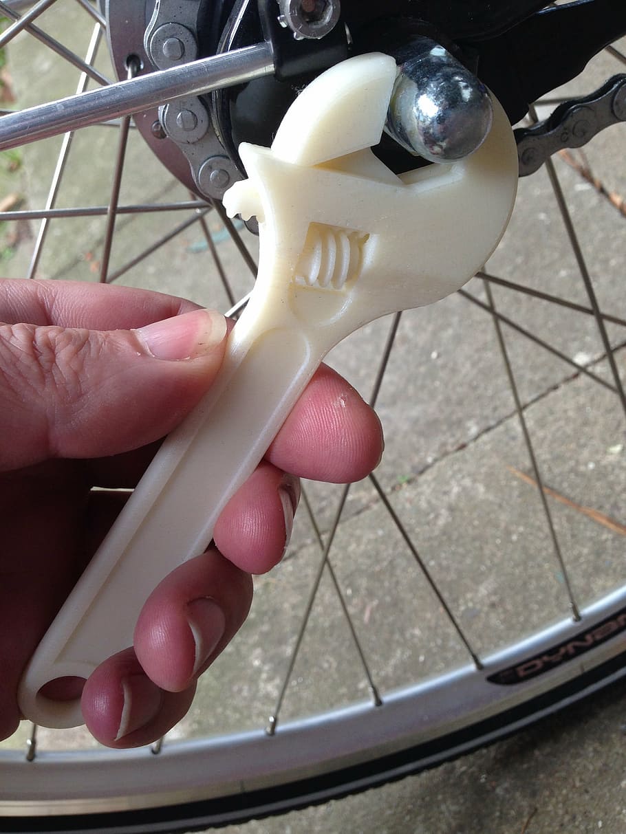 person, turning, bolt, bicycle, using, adjustable, wrench, 3d printing, plastic, bike